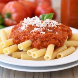Homemade canned spaghetti sauce recipe with penne pasta.