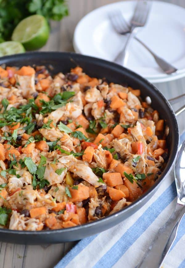 A skillet of cheesy black bean chicken mixture. 