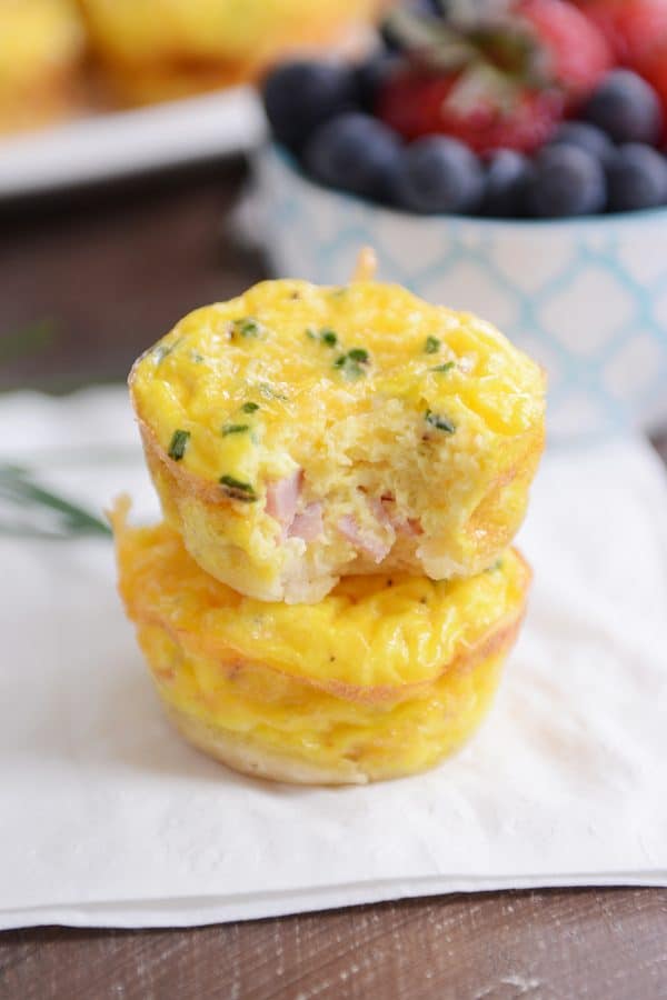 Two mini quiche from the mini quiche recipe on white napkin