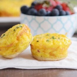 Two mini quiche from the mini quiche recipe on white napkin