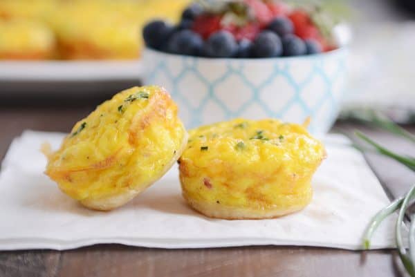 Two mini quiche on a white napkin.