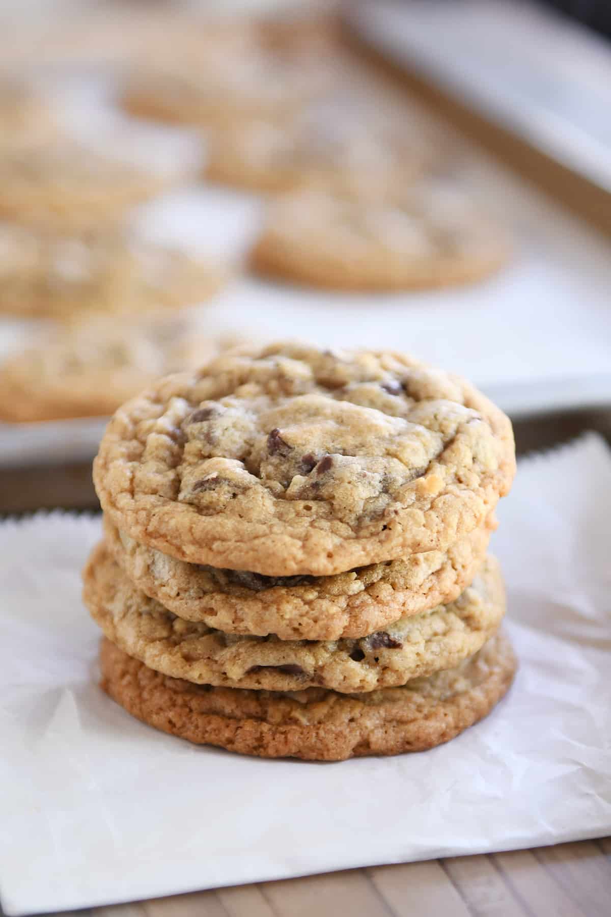 Stack of soft and chewy oatmeal chocolate chip coconut cookies.