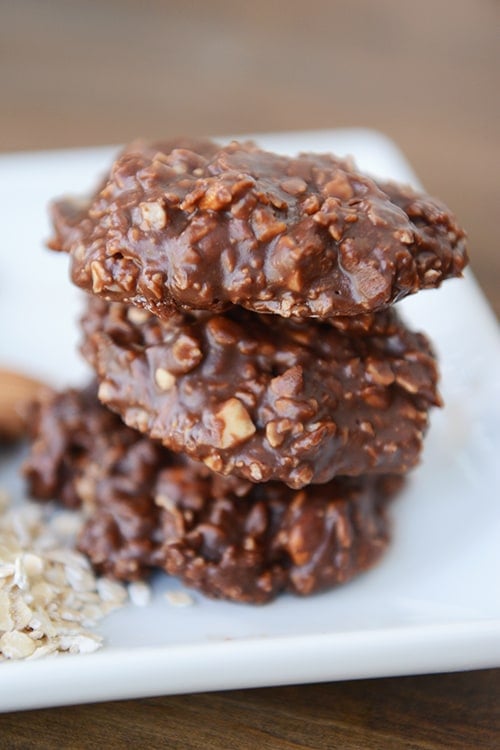 A stack of three chocolate oat no-bake cookies. 