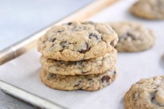 Stack of oatmeal chocolate chip cookies on baking pan.