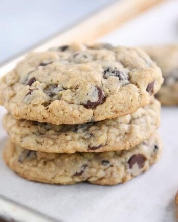 Stack of oatmeal chocolate chip cookies on baking pan.