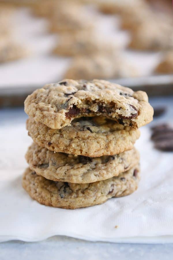 Oatmeal chocolate chip cookies on white napkin.