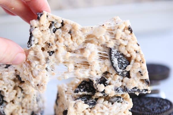 Pulling apart a gooey Oreo rice krispie treat.