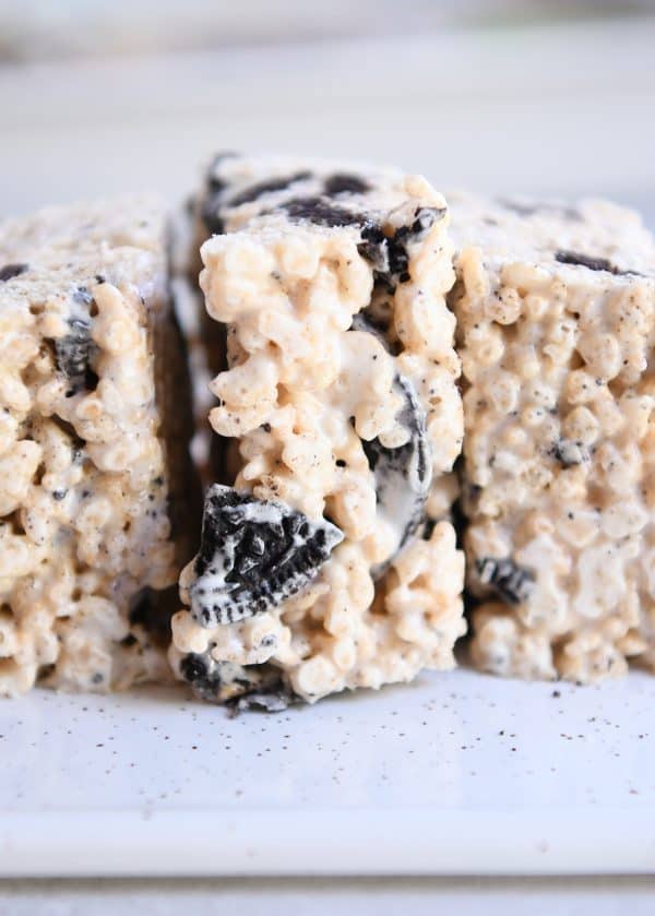 Oreo rice krispie treats side by side on white tray.