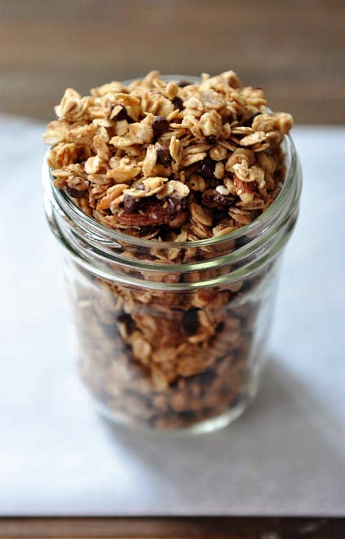 A quart jar filled to brimming with peanut butter granola.