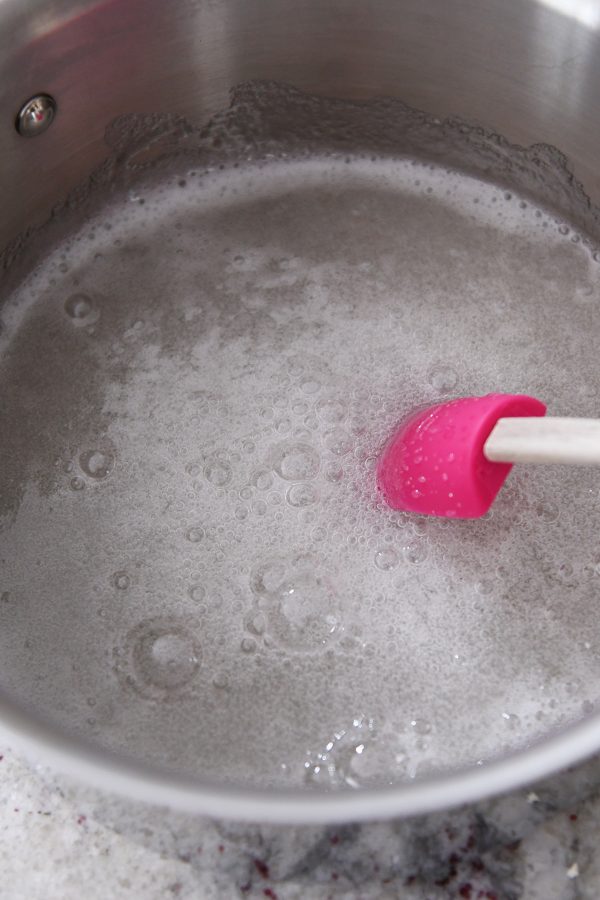 Pan with boiling karo syrup and sugar.