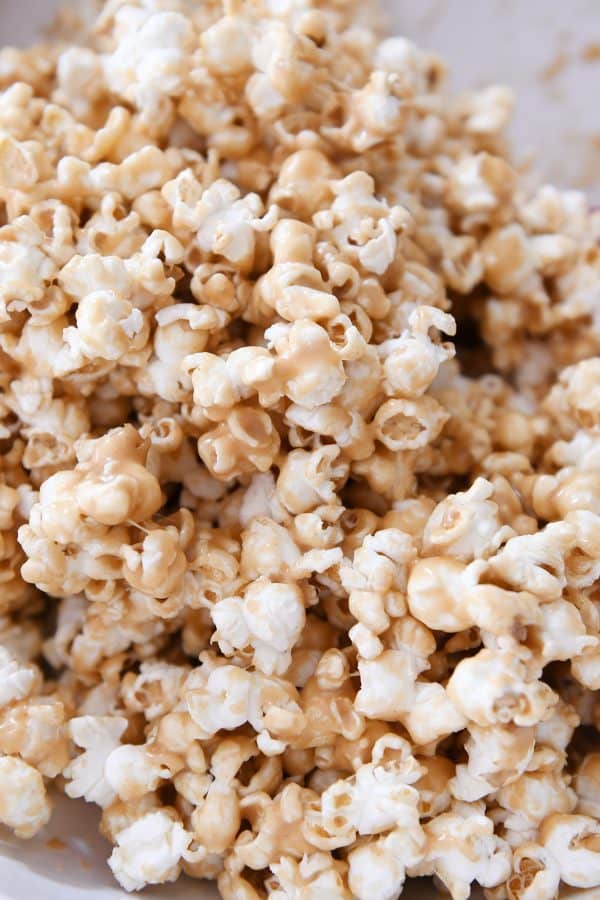 Close up of soft and chewy peanut butter caramel popcorn.