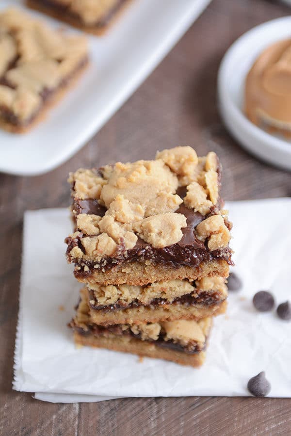 Top down view of three peanut butter fudge bars stacked on top of each other.