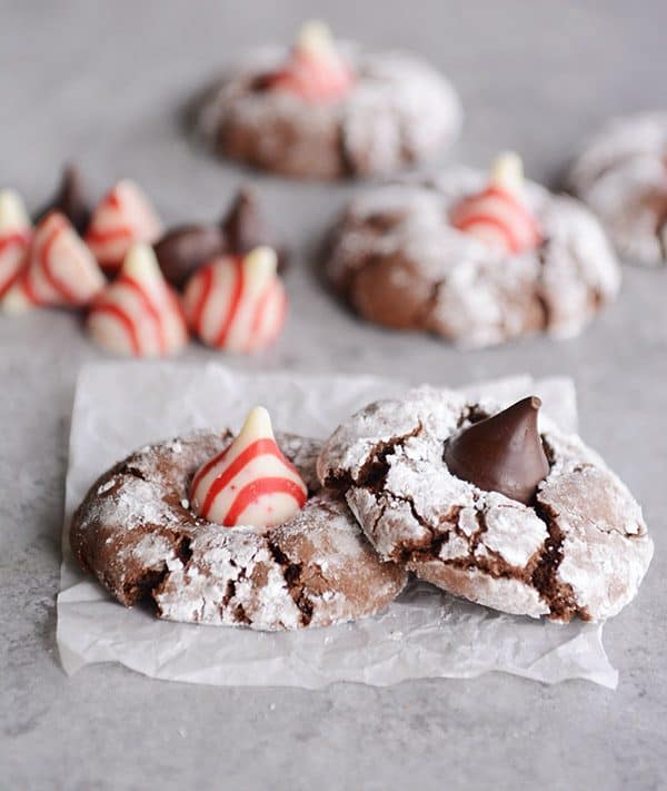Chocolate peppermint blossom cookies on a piece of parchment paper.