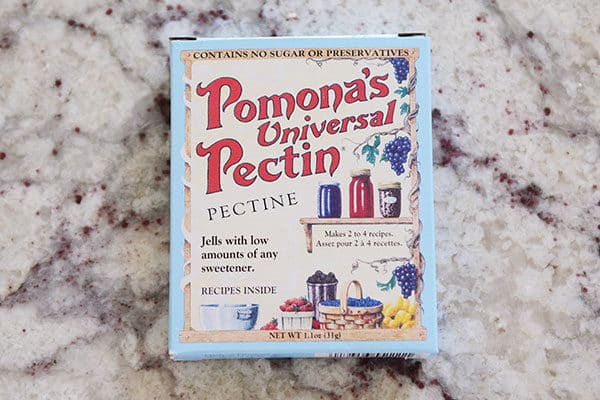 A box of Pomona's Universal Pectin on a granite countertop.