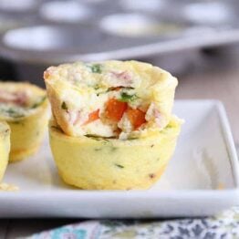 Bite out of healthy egg and veggie muffin.