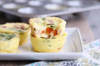 Bite out of healthy egg and veggie muffin.