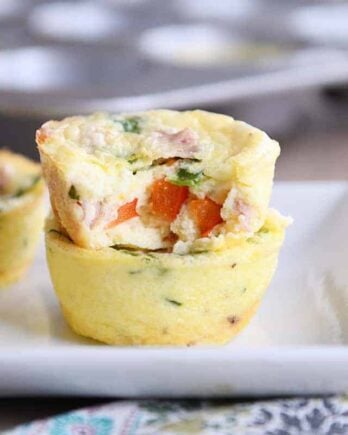 Bite out of healthy egg and veggie muffin.