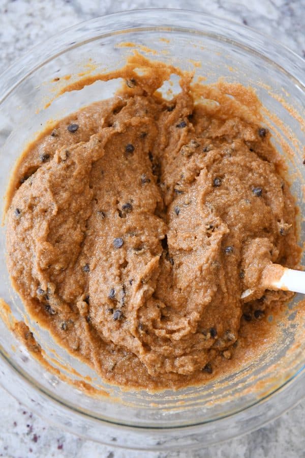 Mixing chocolate chip snack cake batter.