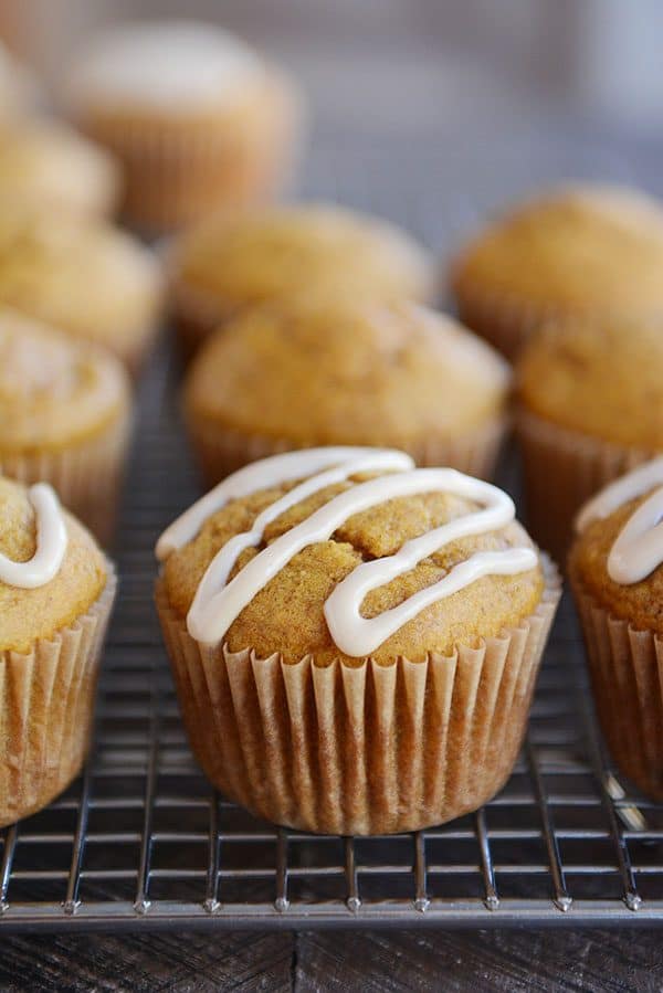 These pumpkin applesauce muffins are the fluffiest, most delicious pumpkin muffins ever! The optional maple glaze is creamy and so tasty drizzled on top!