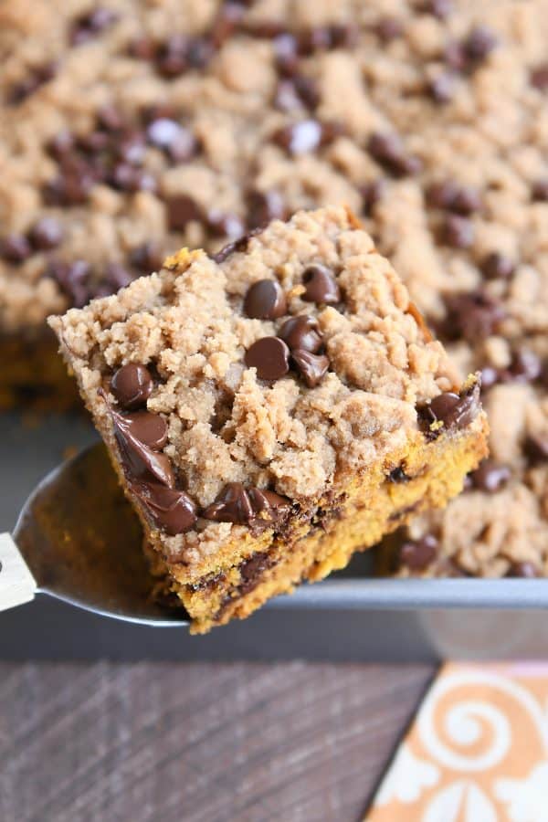 Piece of pumpkin chocolate chip streusel cake on spatula.