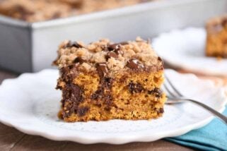 Piece of pumpkin chocolate chip streusel cake on white plate.