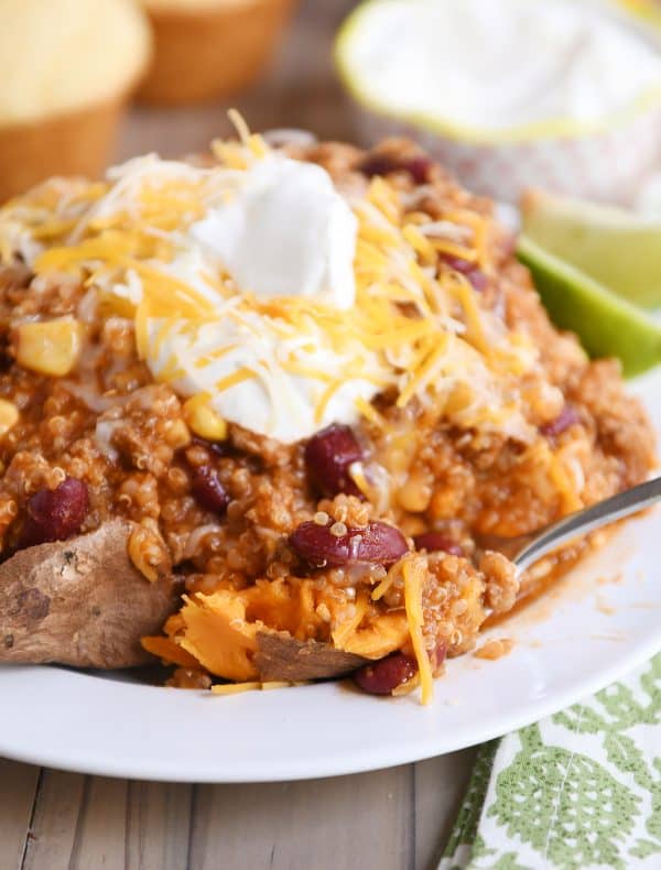 Forkful of sweet potato topped with instant pot quinoa red bean chili.