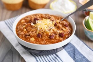 Stone bowl of instant pot quinoa red bean chili with cheese.