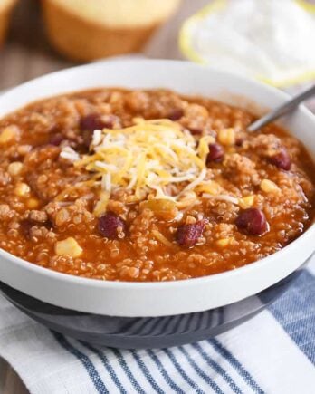 Stone bowl of instant pot quinoa red bean chili with cheese.