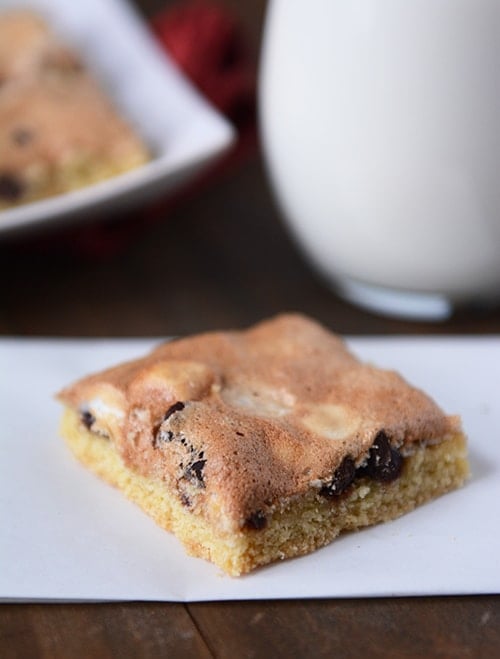 A chocolate chip cookie bar with a meringue topping.