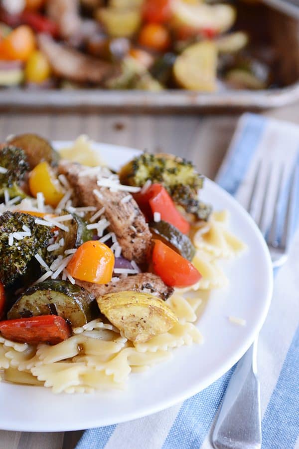 Pasta topped with chicken and veggies.