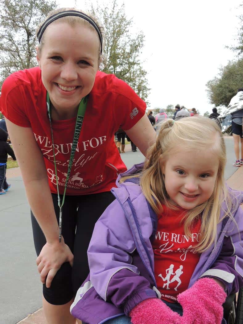 A mom and a little girl in a wheelchair. 