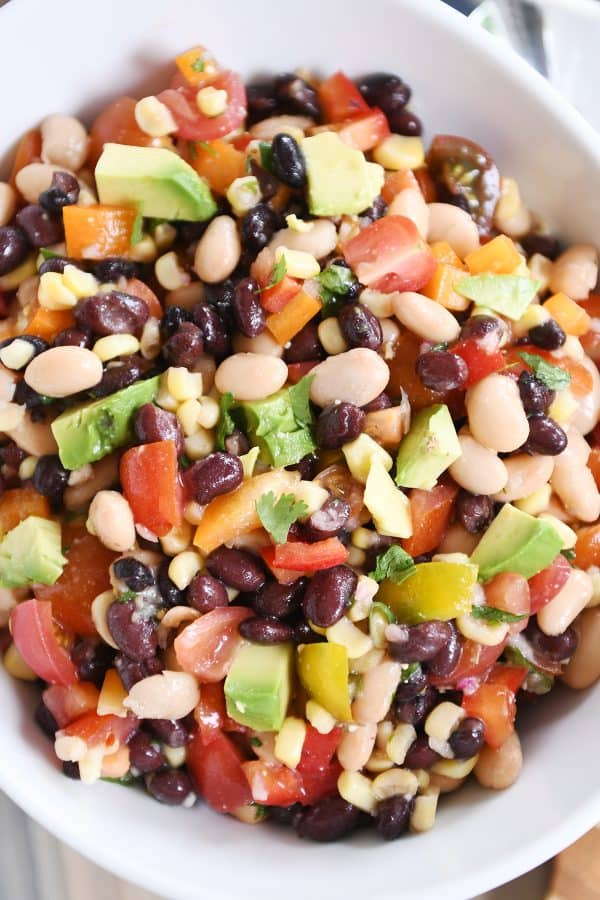 Top view of cowboy caviar dip in white bowl. 