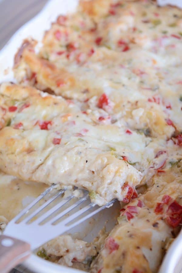 Shrimp enchiladas in white ceramic pan.