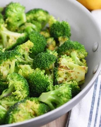 Skillet with roasted broccoli.