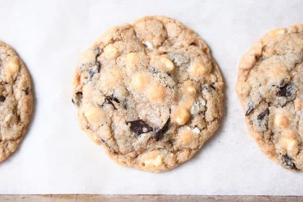 Top view of S'Mores chocolate chip cookie on parchment lined baking tray.