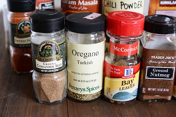 A bunch of spices on a counter. 