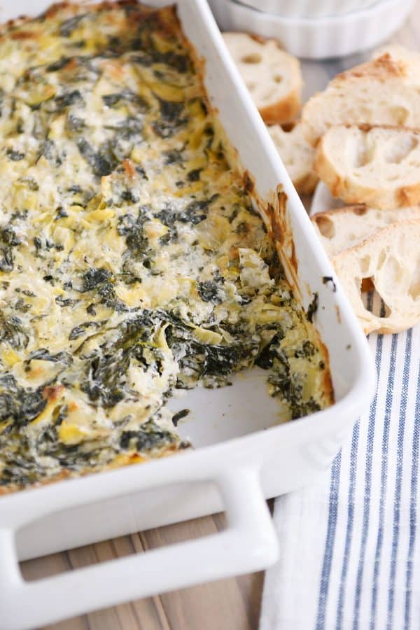 White pan with the best spinach artichoke dip.
