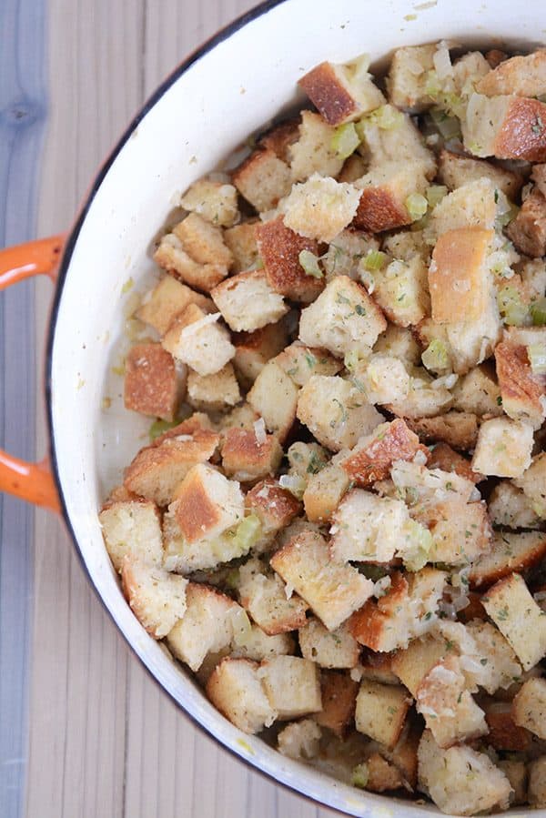 Top view of an orange pot full of homemade stovetop stuffing.