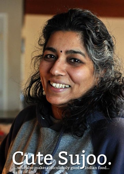 A smiling woman with the text cute Sujoo written on bottom of the picture. 