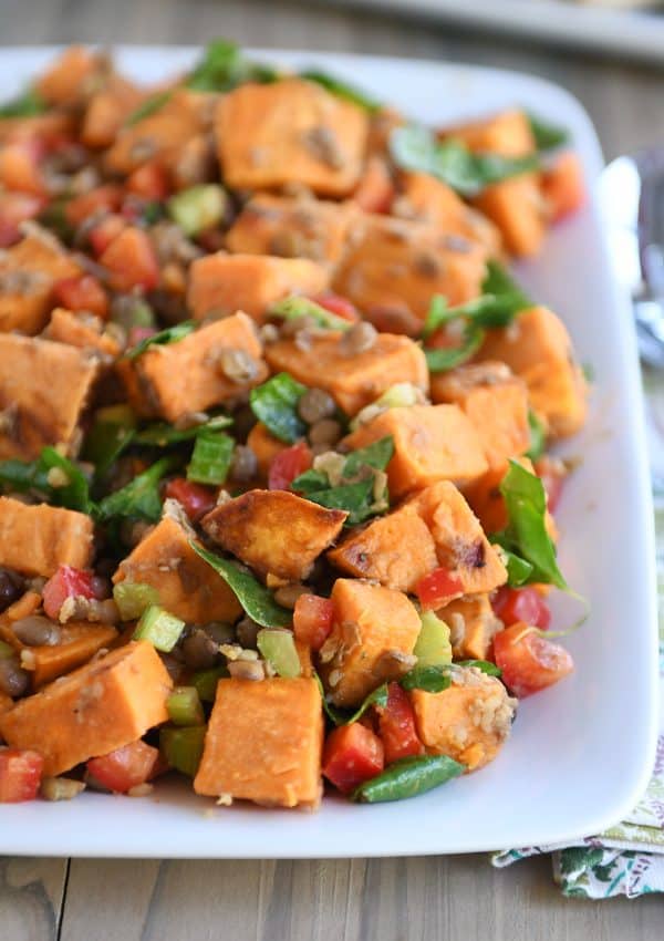 Roasted sweet potato and lentil salad on white platter. 