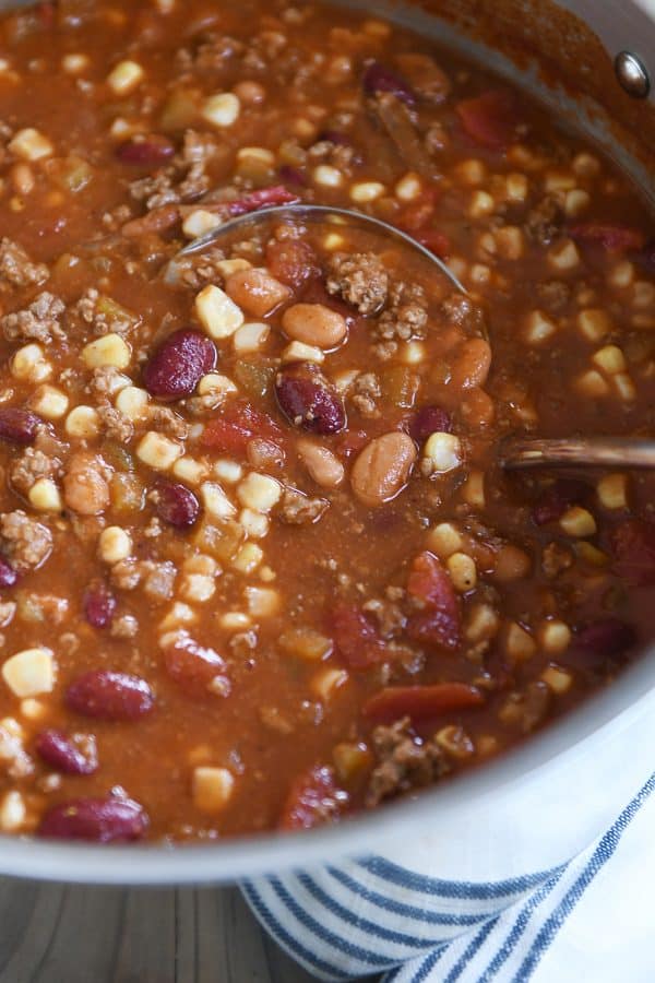 Pot of the best taco soup with ladle in center.