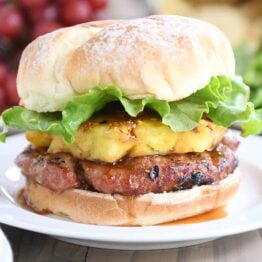 Teriyaki turkey burgers with grilled pineapple, lettuce, and soft bun.