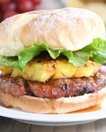 Teriyaki turkey burgers with grilled pineapple, lettuce, and soft bun.