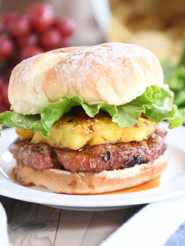 Teriyaki turkey burgers with grilled pineapple, lettuce, and soft bun.