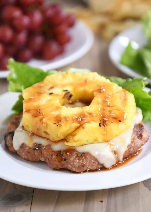 Teriyaki turkey burgers with grilled pineapple, melted Swiss cheese and no bun.