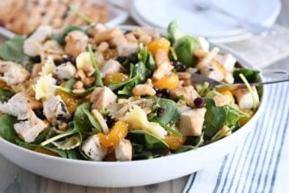 Bowtie pasta salad with teriyaki dressing in large white bowl.