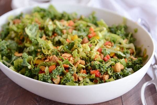 A white oval bowl full of chopped Thai salad.