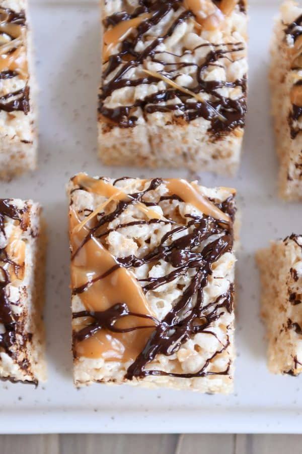 Top down view of Toasted Coconut Caramel Rice Krispie Treats on parchment paper.