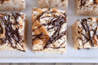 Top down view of Toasted Coconut Caramel Rice Krispie Treats on parchment paper.