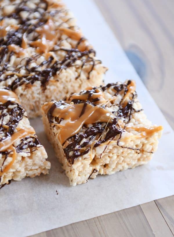 Toasted Coconut Caramel Rice Krispie Treats on parchment paper.